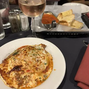 Lasagna, rose, and bread for the table came out with our food (not before)