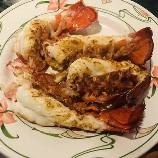 a plate of cooked lobsters