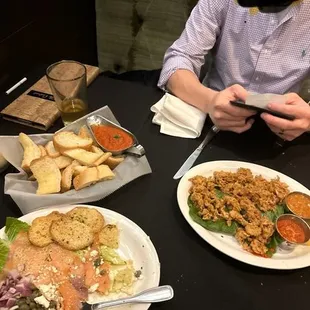 Smoked salmon , calamari, &amp; bread   Smoked salmon chewy  Calamari to salty and the sauces are basic!