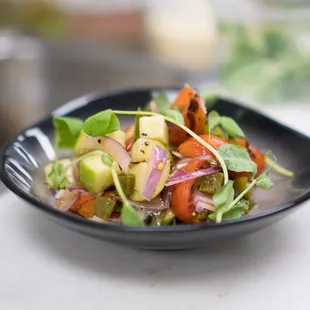 a plate of salad on a countertop