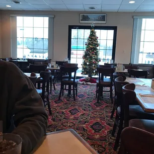 dining area with christmas tree