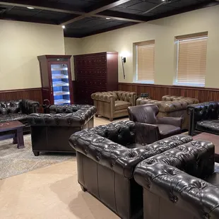 a living room with leather furniture