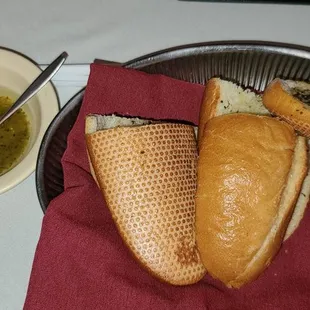 Complimentary garlic bread with garlic butter sauce