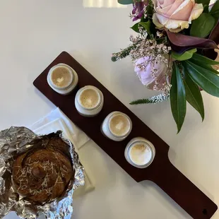 a chocolate cake and three cups of coffee