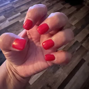 1 week old acrylic gel in classic red and still looks GREAT!!! Very attentive to be sure the nails were how I wanted them!