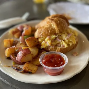 Breakfast croissant with potatoes