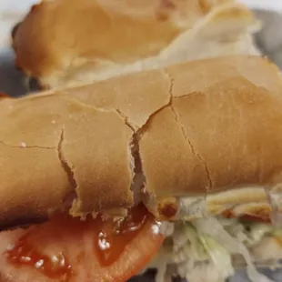 Half of a cheese hoagie, still big enough to be served cut into two.