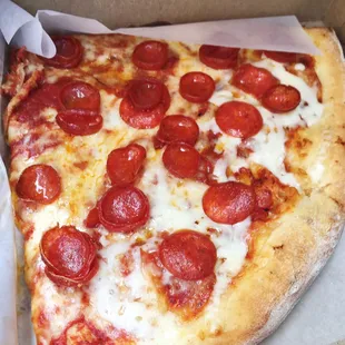 Two slices of pepperoni to go! I could eat their pizza every day.