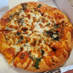 Small cheese pizza with spinach