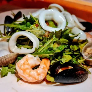 a plate of seafood and salad