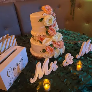 a wedding cake and table with candles