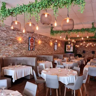 a dining room with tables and chairs