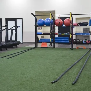 Fitness Floor includes a turf field with function items