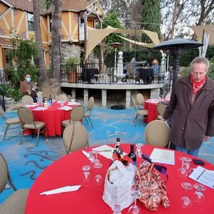 a group of people standing around a table