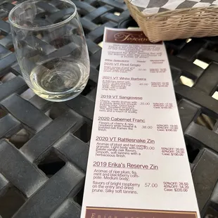 a wine glass and menu