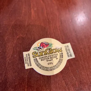 a sunflower label on a wooden table