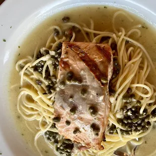 Salmon Piccata (butter lemon sauce &amp; capers in white wine) served with spaghetti.