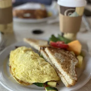 an omelet and a sandwich on a plate