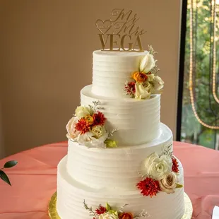 Almond wedding cake with strawberry mousse filling and buttercream