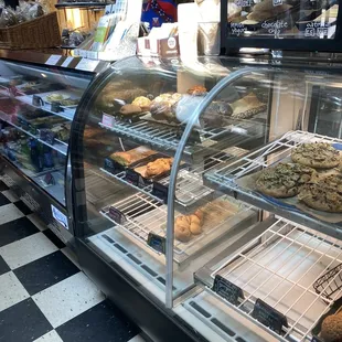a display case with a variety of baked goods