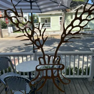 a table and chairs with an umbrella