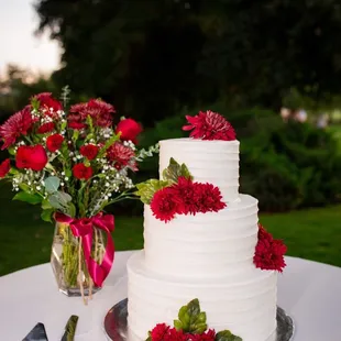 a wedding cake and flowers