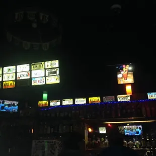 neon signs above the bar