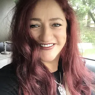 a smiling woman with red hair