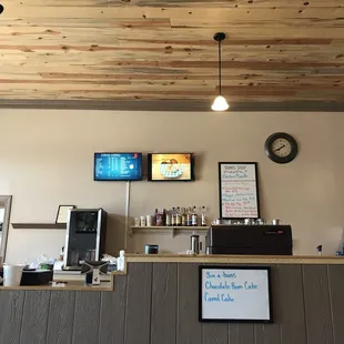 a counter with a clock on the wall