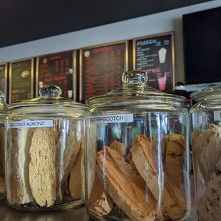a variety of cookies in glass jars