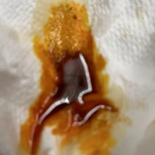 a piece of food with sauce on it