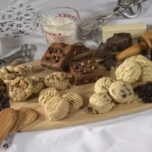 a wooden cutting board with various ingredients