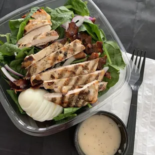 Ordered via Door Dash. Gorgeous spinach salad with grilled chicken &amp; onion vinaigrette dressing. Fresh and delicious!