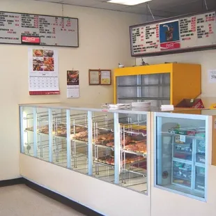 a display case with a variety of donuts