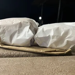 Giant double cheese with bacon on the left, deluxe double cheeseburger on the right. Look at the difference