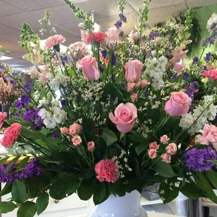 Sympathy arrangement in pinks, lavenders and white.