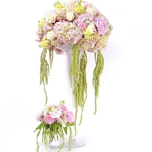Pink hydrangea, white roses hanging ameranthus were used to create these dramatic centerpieces.