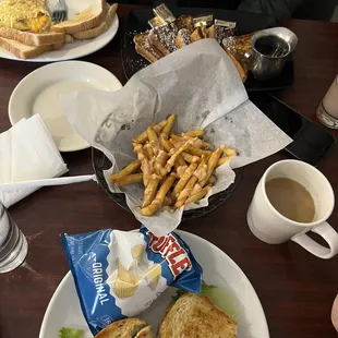 a plate of sandwiches and french fries