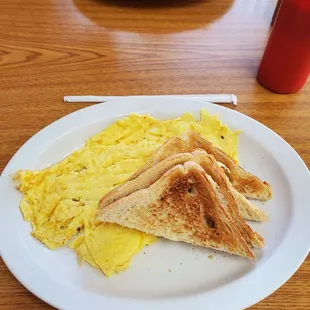 Scrambled eggs and buttered toast