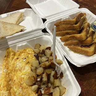 Seafood omelette, home fries, and French toast.