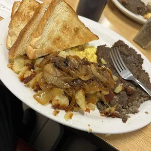 The Daily special! 2 eggs home fries wit onions toast and scrapple