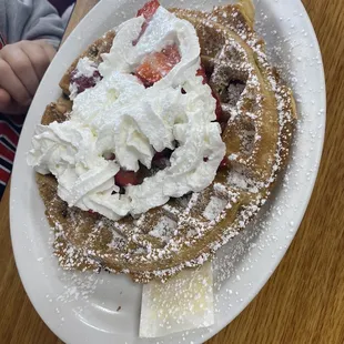 Waffle with chocolate chips/strawberries and whipped cream