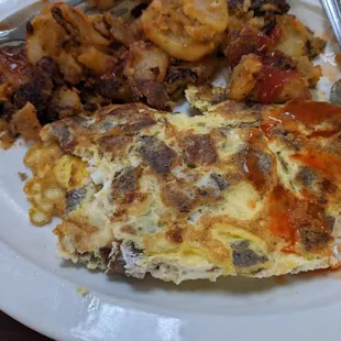 Gyro and feta cheese omelette with home fries and toast