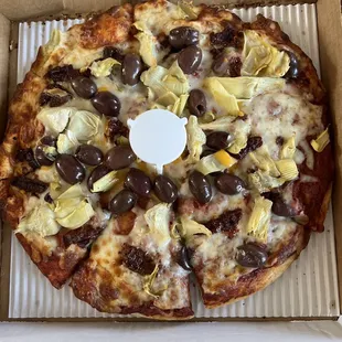 Small pizza with, Kalamata olives, sun dried tomatoes, artichoke hearts.