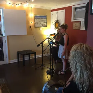 a group of people in a living room