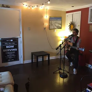 a man playing a guitar