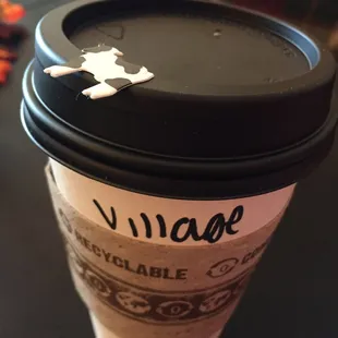 Get your coffee to go and a cow sticker (serves as lid stopper).