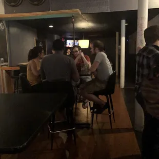 a group of people sitting around a table