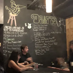 people sitting at a table in a restaurant