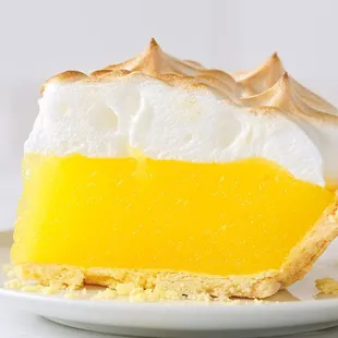 Lemon Meringue Pie - Whipped and baked egg whites toasted to meringue on top of a tangy lemon filling inside our flaky pastry crust.